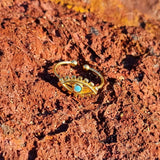 Our Statement Evil Eye Ring features the beautiful evil eye symbol on a delicate adjustable band. The Evil eye is one of the strongest symbolic images in the world. Wearing Evil Eye Jewelry is believed to provide the protection against the evil forces. You can wear it on its own as a statement piece or paired with other stackable rings. Material:  18K Gold Vermeil with a Sterling Silver base