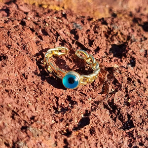 Our original Evil Eye Chain Ring featuring a simple form of our favourite Ancient symbol; the evil eye. Bound by an adjustable gold chain band, this piece is both a classic and stylish piece. We recommend pairing it with two or more rings for the best look and feel.  Material:  18K Gold Vermeil with a Sterling Silver base
