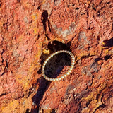 Our Beaded Stack Ring is the ideal layering piece. Featuring a gold beaded band, this piece can be combined with any other rings as the perfect compliment. For a bolder look, we recommend stacking two beaded stack rings on the same finger.   Material:  18K Gold Vermeil with a Sterling Silver base
