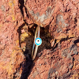 Increase your ring collection with our Evil Eye Staple Ring, a dainty ring featuring the Evil eye on a delicate gold band. Wear it alone for a minimalist look or stack it together with other stacking rings.  Material:  18K Gold Vermeil with a Sterling Silver base