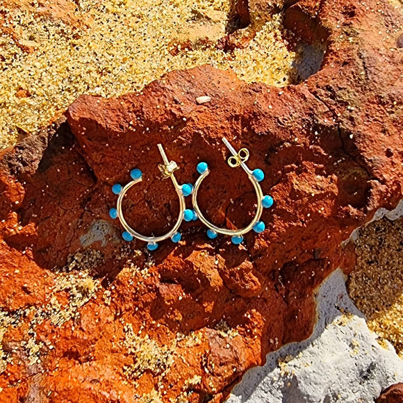 Our Turquoise Hoops beautifully features delicate turquoise coloured stones. The color turquoise is associated with meanings of refreshing, feminine, calming, creativity, emotional balance, and patience making it a favourite colour of Salaqua. Pair it with one of our Evil Eye necklaces.  Material:  18K Gold Vermeil with a Sterling Silver base